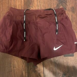 Brand new with tag marroon nike running shorts